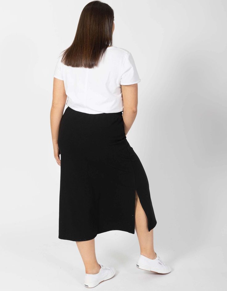 DESCRIPTION Stylish, versatile and oh-so-comfortable, the Travel Skirt from Elm will be your new season go-to! Crafted from easy wear unbrushed French terry this flattering maxi skirt features an elastic waistband, contrast drawstring, and side splits. Perfect for travel, don't forget to pack this style on your next trip away. Pair with a tee and denim jacket for a chic everyday look. FEATURES & FIT Comfy cotton unbrushed fleece fabric Elasticised waistband with contrast drawstring Maxi-length Side splits Designed in Australia Fit: Take your usual size. Model 1 is 175cm tall and wears size 10(AU)/6(US). Model 2 is 175cm tall and wears size 16(AU)/12(US). FABRIC & CARE 95% cotton, 5% elastane Cold gentle machine wash This colour will continue to fade Travel Skirt, Split Design, Easy Wear, Online Womens Clothing, Fleece Fabric, New Season, Everyday Look, French Terry, Maxi Skirt