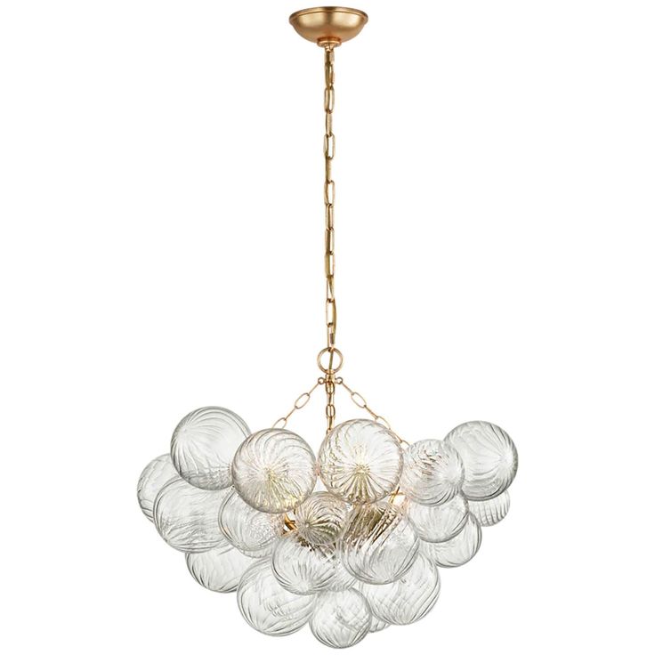 a chandelier with glass balls hanging from the ceiling