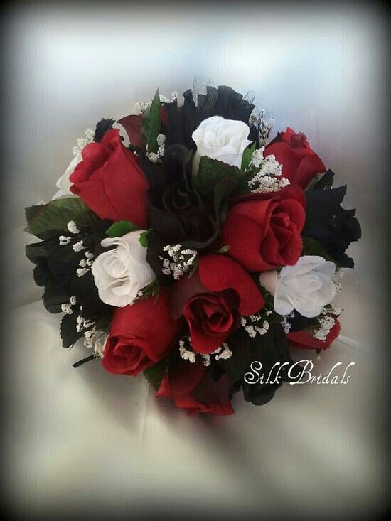 a bridal bouquet with red and white roses