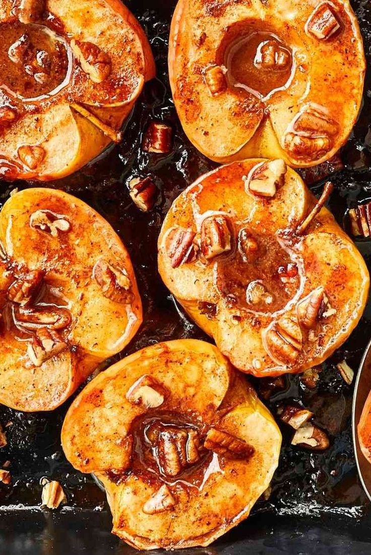 baked sweet potatoes with pecans and caramel sauce in a baking dish, ready to be eaten