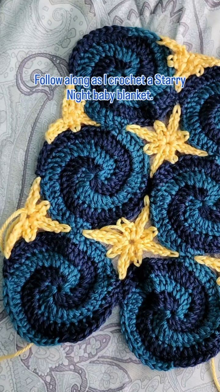 four crocheted coasters with yellow and blue circles on them sitting on a bed