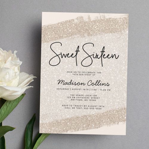 there is a white flower next to a card with the word sweet sixteen on it