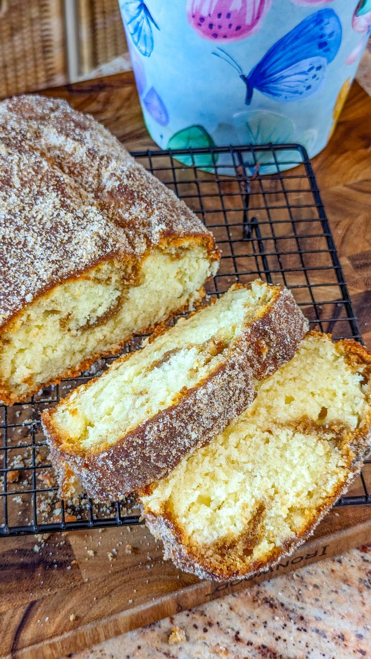 a loaf of cake sitting on top of a cooling rack