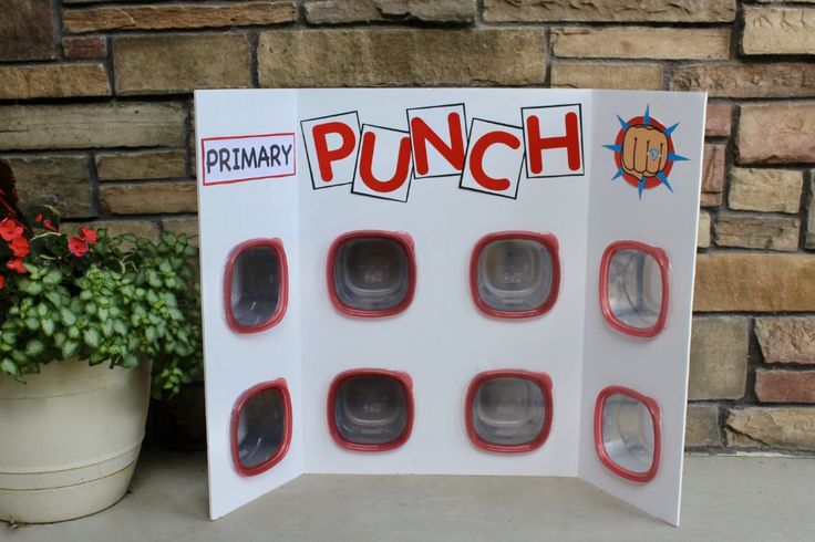 a punch game sitting next to a potted plant