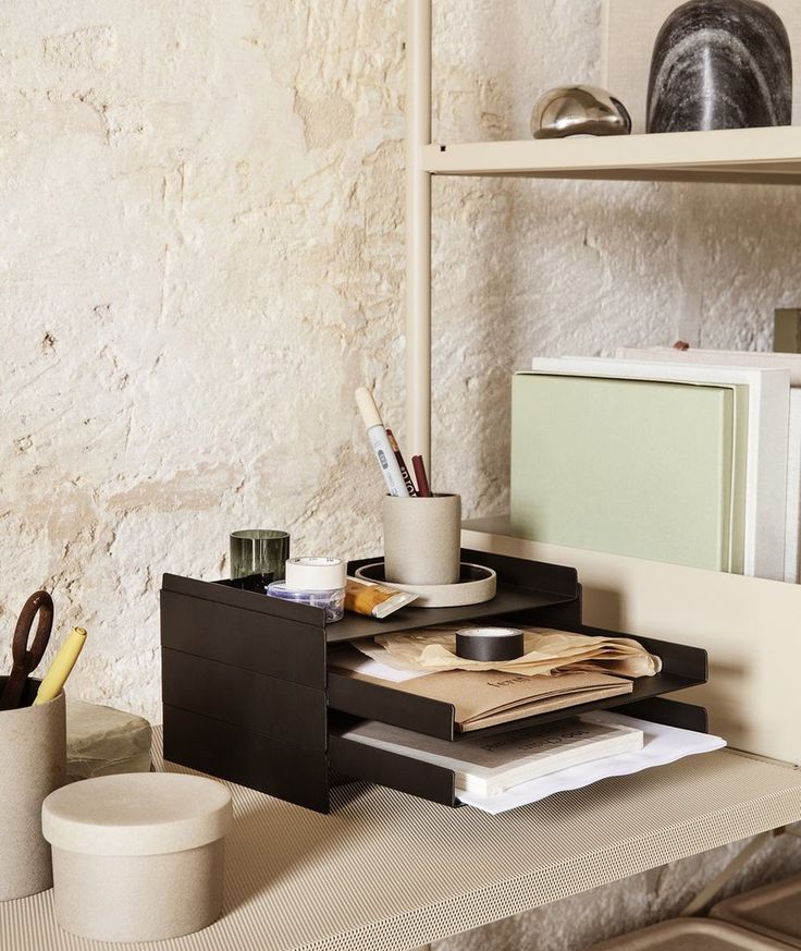 a desk with some books and papers on it