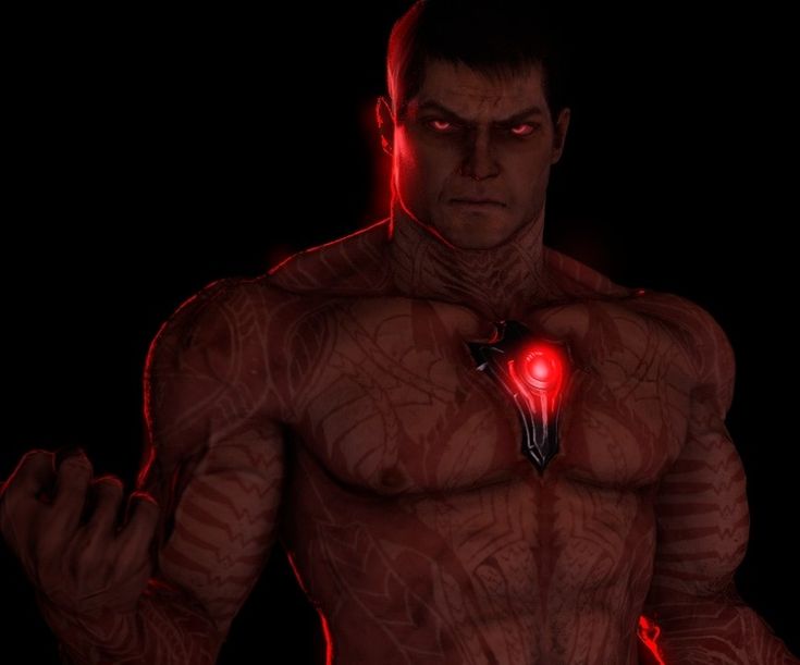 a man with red lights on his chest and arm, standing in front of a black background