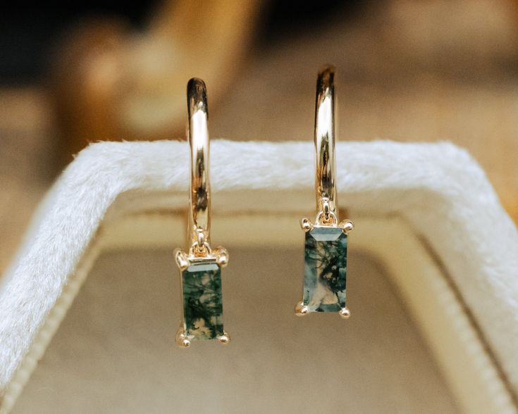 These delicate earrings are crafted with meticulous attention to detail. The focal point is the mesmerizing moss agate gemstones, each possessing a unique landscape of moss-like inclusions reminiscent of a miniature forest captured in stone. The moss agate stones, polished to a gentle sheen, exude a serene, organic beauty, with hues ranging from deep greens to translucent whites, evoking the tranquil essence of nature. Whether worn for a special occasion or to add a touch of elegance to everyday Moss Agate Earrings, Miniature Forest, Moss Agate Bracelet, Moss Agate Jewelry, Womens Matching Sets, Staghead Designs, Antique Gift, Agate Earrings, Custom Ring Designs