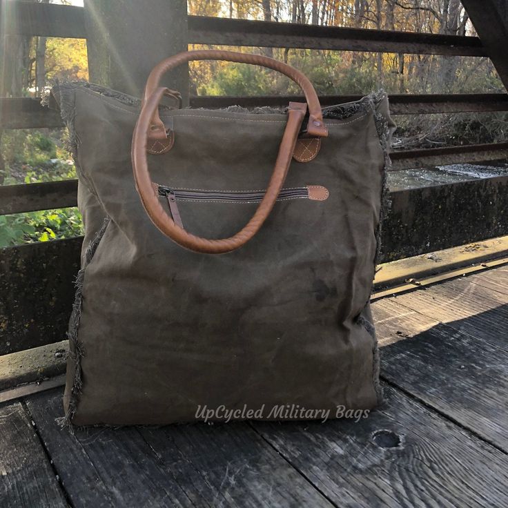 "Infantry Soldier Weekender Tote Bag made of Repurposed Military Canvas and CowHide with leather accents. Hair on Hide and UpCycled Canvas combined to make this gorgeous Large Weekender Tote that's made of repurposed military tent and tarp canvas. A classy, and impressive Bag ready for an overnight escapade, a day on the run, or to carry everything you need for an active life on the go. Great as a Military Mom or Wife gift. Purse * Large Tote * Shoulder Bag * Weekender DETAILS * Size: 16\" x 18\ Infantry Soldier, Upcycled Tote, Best Beach Bag, Military Bag, Military Mom, Army Mom, Statement Bag, Canvas Crossbody Bag, Weekender Tote Bag