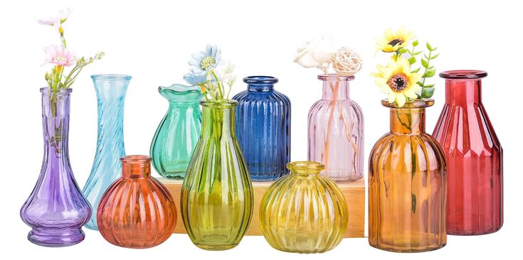 there are many different colored vases in this group together, each with one flower