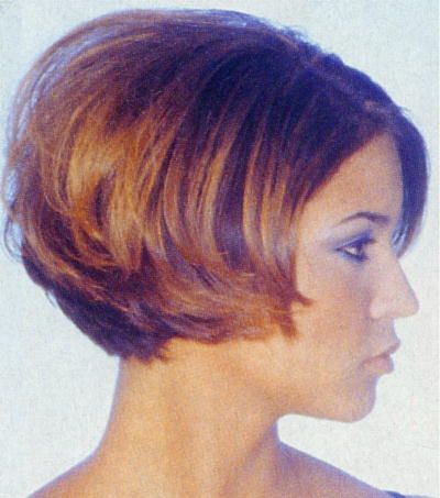 an image of a woman with short hair in the middle of her face and side view