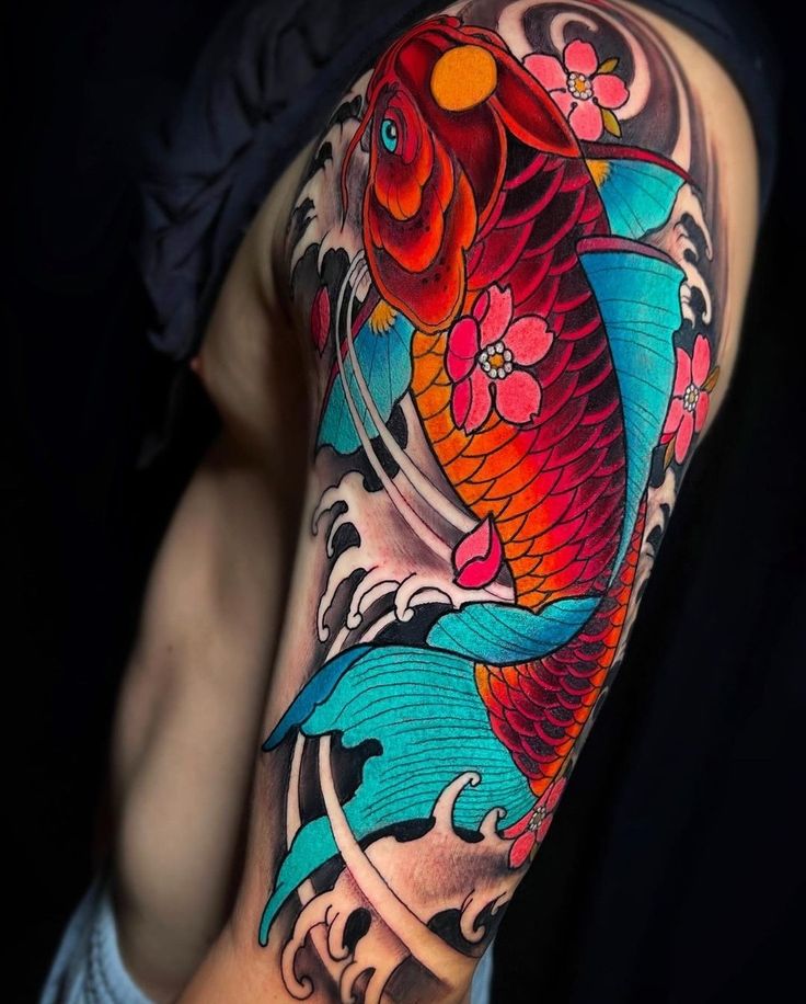 a man's arm with a colorful koi fish tattoo on it