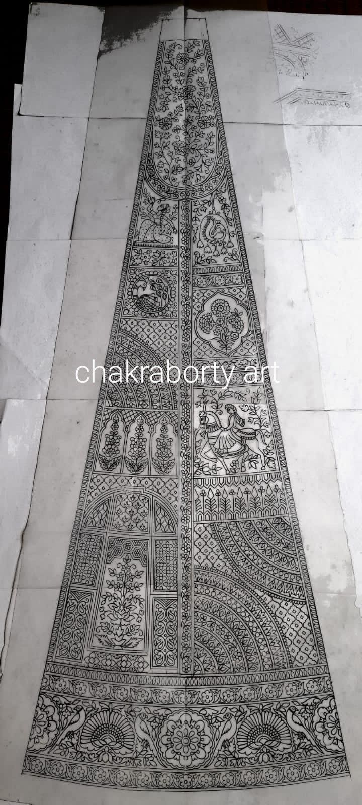 an intricately designed rug is being worked on