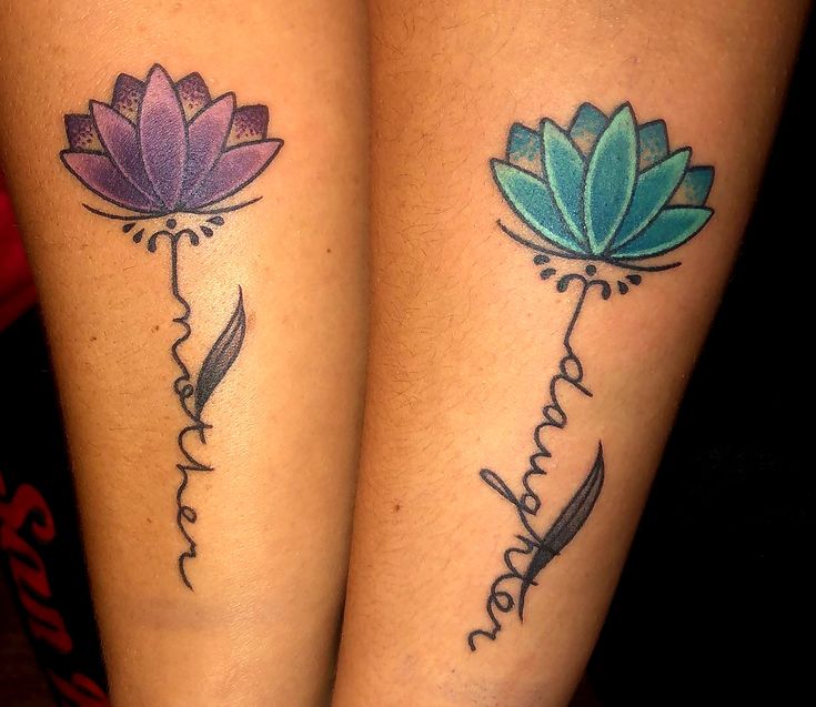 two tattoos with flowers on their legs