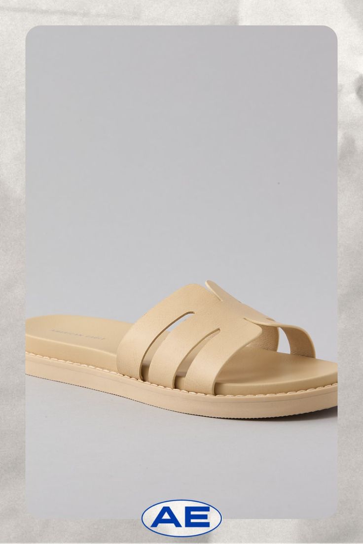 Vegan leather upper/Open toe/Rubber outsole Beige Leather Sandals With Textured Sole, Beige Synthetic Sandals With Single Toe Strap, Beige Synthetic Sandals With Rubber Sole, Beige Leather Flat Sandals, Beige Flat Leather Sandals, Modern Beige Sandals With Textured Footbed, Beige Flat Sandals With Leather Footbed, Modern Beige Sandals With Leather Footbed, Leather Footbed Sandals In Beige For Spring