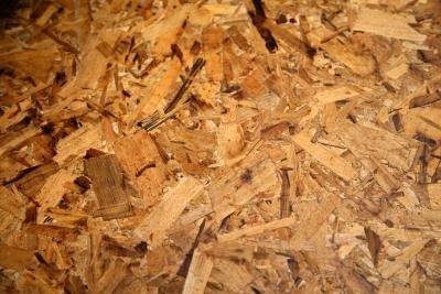 a pile of wood chips sitting on top of a wooden floor