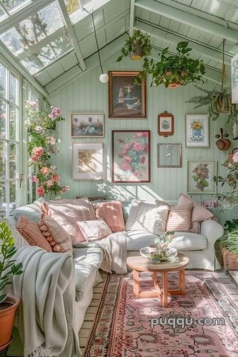 a living room filled with furniture and lots of plants