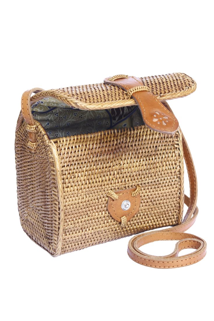 Small Basket bag, rattan ata shoulder cross-body straw basket. Perfect to carry your daily essentials, sunglasses, lipstick, cell phone and coin purse. (PRODUCT INFO): Size: 6" H x 6" W x 4" D/15cm H x 15cm W x 11cm D. Strap drop: 24" inches/60cm. Material: Handwoven Ata. Lining: Batik print cotton. Leather strap. Leather snap clasp closure. (SHIPPING INFO): All our items are made-to-order, therefore please allow 3-5 business days for production. Our goal is to become more sustainable throughout Bucket Straw Bag With Adjustable Strap As Gift, Natural Straw Bag For Everyday Use With Phone Pocket, Rectangular Natural Bucket Bag With Mobile Phone Bag, Travel Rattan Bucket Shoulder Bag, Travel Bucket Shoulder Bag In Rattan, Rectangular Natural Color Bucket Bag With Phone Bag, Natural Straw Crossbody Bag With Phone Pocket, Rectangular Natural Bucket Bag As A Gift, Crossbody Straw Bag With Adjustable Strap As Gift