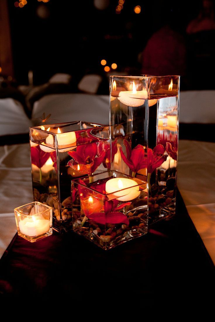 candles are arranged in cubes on a table