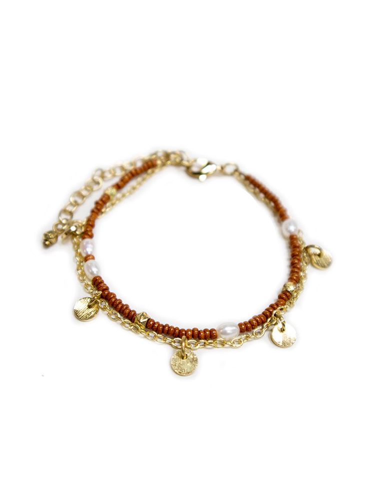 This beaded bracelet gives you the two-in-one layered look with a subtle shimmer of pearl and pops of gold. Perfect for adding to your favorite stack of layered wrist accessories. Seed beads, freshwater pearls, and brass 7" length Made fair trade in India by one of our longstanding production partners Gold Bracelets With Gold Beads For Summer, Gold Bracelet With Pearl Charm For Beach, Gold Pearl Charm Bracelet For Beach, Brown Beaded Bracelet For Summer, Gold Pearl Bracelet With Pearl Charm For Beach, Summer Brown Beaded Bracelets, Everyday Bohemian Gold Beads, Bohemian Gold Pearl Bracelet With Round Beads, Gold Beaded Chain For Summer