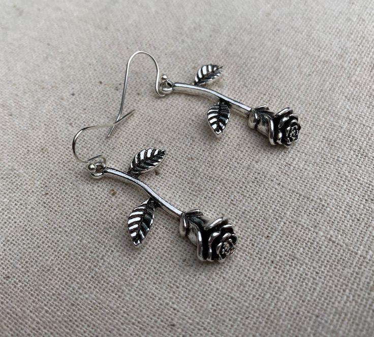 "These are simple stunning and unique! Single stem long rose earrings are exquisitely detailed and have incredible design. They would make the perfect gift for a loved one. A rose that never dies! The earrings measure 1 3/8\" long by 1/2\" wide at the flower part. Over all drop length is 1 1/2\". They hang from simple silver ear wire hooks. Made from allergy free plated silver. I have a matching necklace in my shop if you would like the whole set. Here is a direct link https://etsy.me/31ZuIRh Th Rose Color Flower Drop Earrings, Rose Drop Earrings With Rose Design, Sterling Silver Rose Earrings With Rose Design, Rose Design Sterling Silver Earrings, Boho Hoop Earrings, Silver Chandelier Earrings, Parts Of A Flower, Rose Jewelry, Unique Jewelry Designs