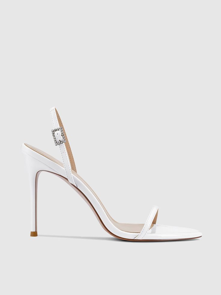 The Lyon Sandal is an elegant design imbued with beauty and sophistication. This stand out silhouette features a flattering crystal-embellished buckle, making her an elegant addition to your evening wardrobe. Vegan upper Vegan insole Vegan outsole Open pointed toe Adjustable slingback strap Handmade Designed in LA Self-covered stiletto heel, 3.93" (100mm) Elegant Heels, Lace Boots, Boot Sandals, Stiletto Heel, Uganda, Trinidad And Tobago, Lyon, Elegant Design, Stiletto Heels