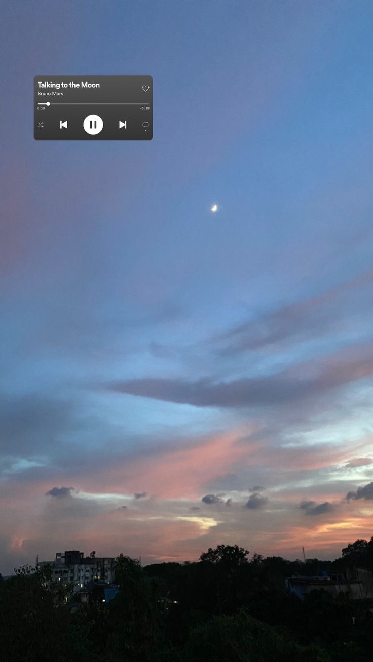 an image of the sky at dusk with clouds