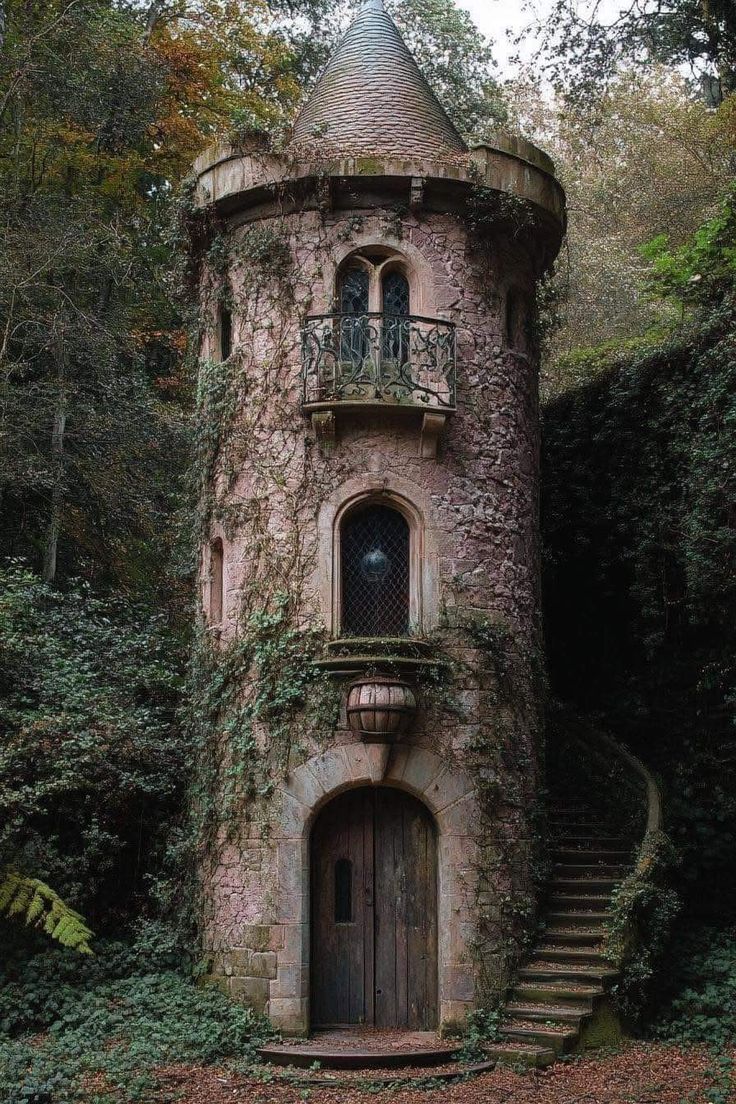 an old stone building with stairs leading up to it