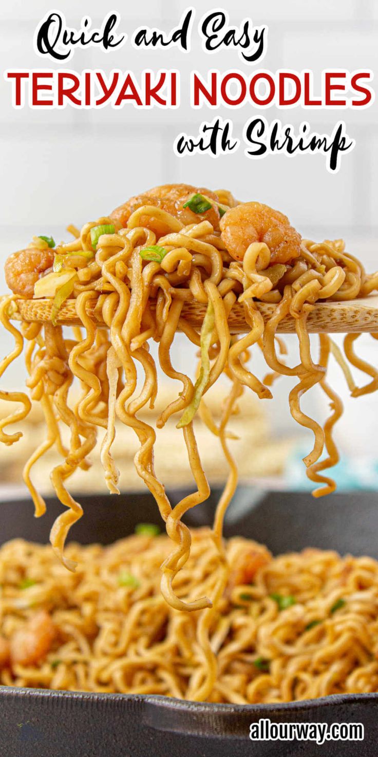 a pan filled with noodles and shrimp being lifted from the skillet