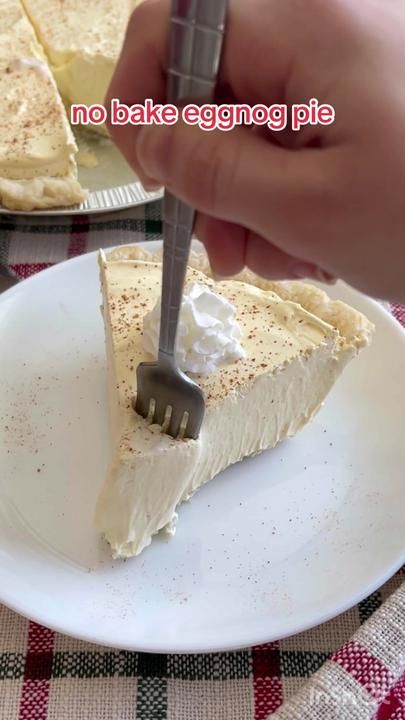 there is a piece of pie on the plate with a fork and knife in it