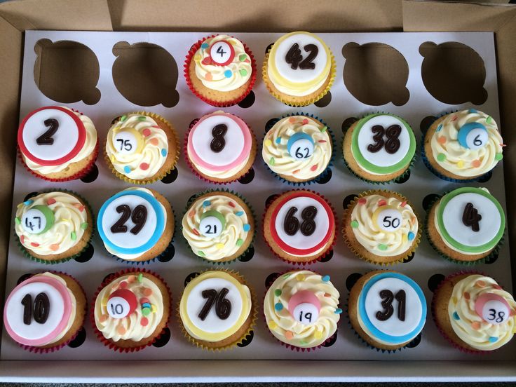 cupcakes with numbers are arranged in a box