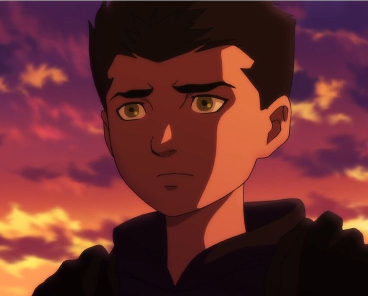 a young man staring at the camera in front of a sunset with clouds and blue sky