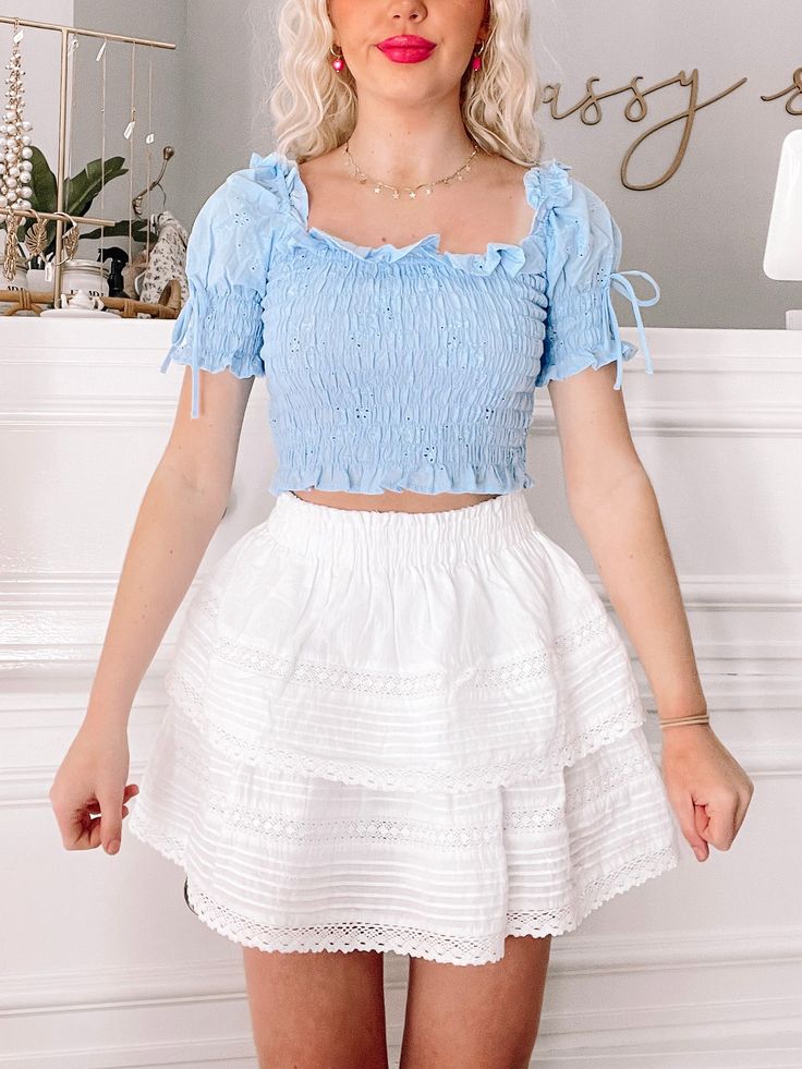 Blue Heart to Heart Top | sassyshortcake.com | Sassy Shortcake Cute Puff Sleeve Top With Ruffles For Spring, Spring Tiered Skirt Smocked Top With Ruffle Hem, Cute Smocked Top With Ruffles For Day Out, Cute Ruffled Smocked Top For Day Out, Spring Cute Smocked Top, Cute Smocked Top For Spring Day Out, Cute Smocked Top For Day Out, Cute Puff Sleeve Smocked Top, Cute Smocked Top With Puff Sleeves