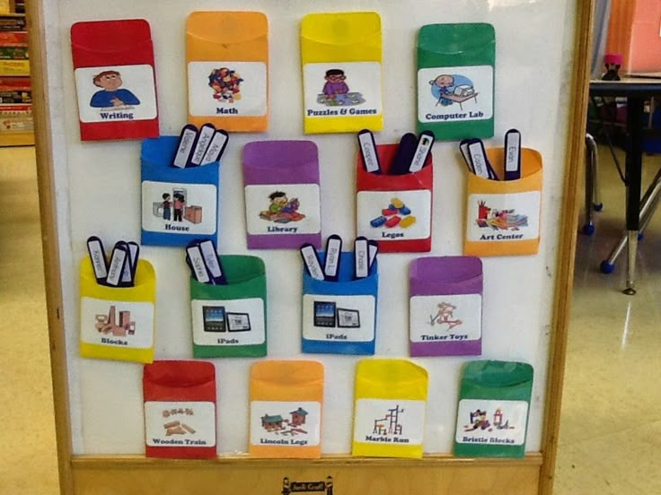 a bulletin board with many different colored magnets on it's sides and words written in small letters