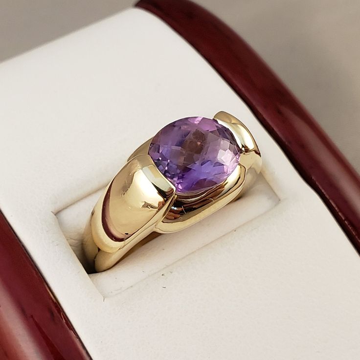 "\"Previously Loved, Not New\" Vintage Amethyst Ring, Featuring a Genuine Amethyst center (*Price of the ring is really gold only. The center is pretty scratched on the surface.*) This Genuine Purple Amethyst center stone is a checkered board cut oval shape. 14k Yellow Gold setting with 2 heavy bars. **Ring size: 6.25 **Amethyst is February's Birthstone, AND 2018 color of the year. This item can be sized up or down 2 sizes for an additional $30.00 Please feel free to contact me anytime, if you h Vintage Amethyst Ring, Checkered Board, Amethyst Rings, Amethyst Ring Vintage, Ring Purple, Lapis Ring, Rings Vintage, Yellow Gold Setting, Purple Band