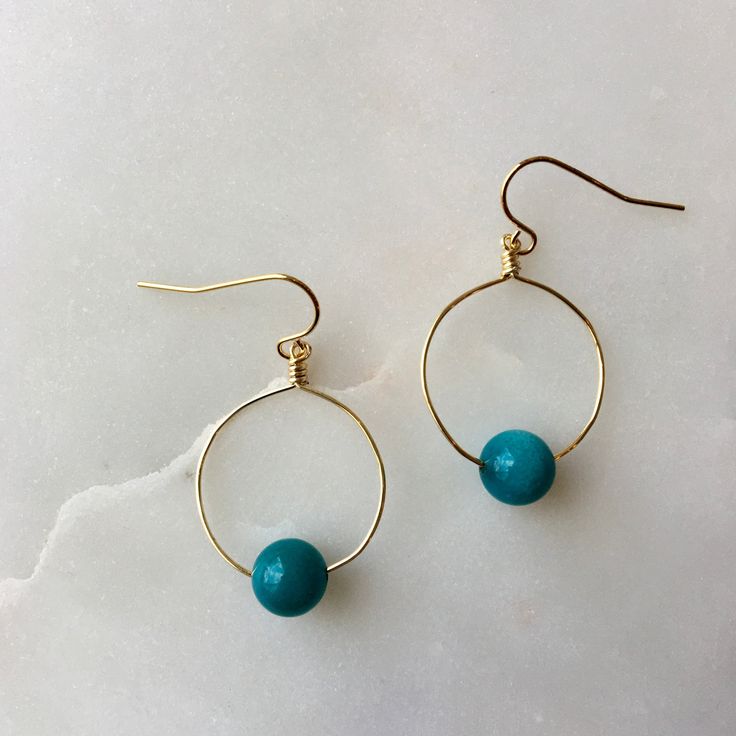 The Mini hoops feature a bright, colorful bead or gemstone of your choice on a round hoop that is wire-wrapped and secured to an elegant ear wire. These hoop earrings are mindfully made with high-quality, gold-plated metals. They are nickel-free and safe for sensitive ears. If you have additional allergies, please contact me before purchasing. I have sterling silver, gold-filled, or hypoallergenic titanium ear wires available by request. The earrings are approximately 1 3/4" long x 1" wide, incl Gift Hoop Earrings With Natural Stones, Adjustable Hoop Earrings With Natural Stones, Hoop Earrings With Round Natural Stones For Gift, Hand Wrapped Round Beads Earrings As Gift, Circular Beaded Earrings With Ear Wire For Gifts, Circular Beaded Earrings With Ear Wire As Gift, Small Hoop Wire Wrapped Beaded Earrings As Gift, Gift Small Hoop Beaded Earrings Wire Wrapped, Wire Wrapped Round Beaded Earrings