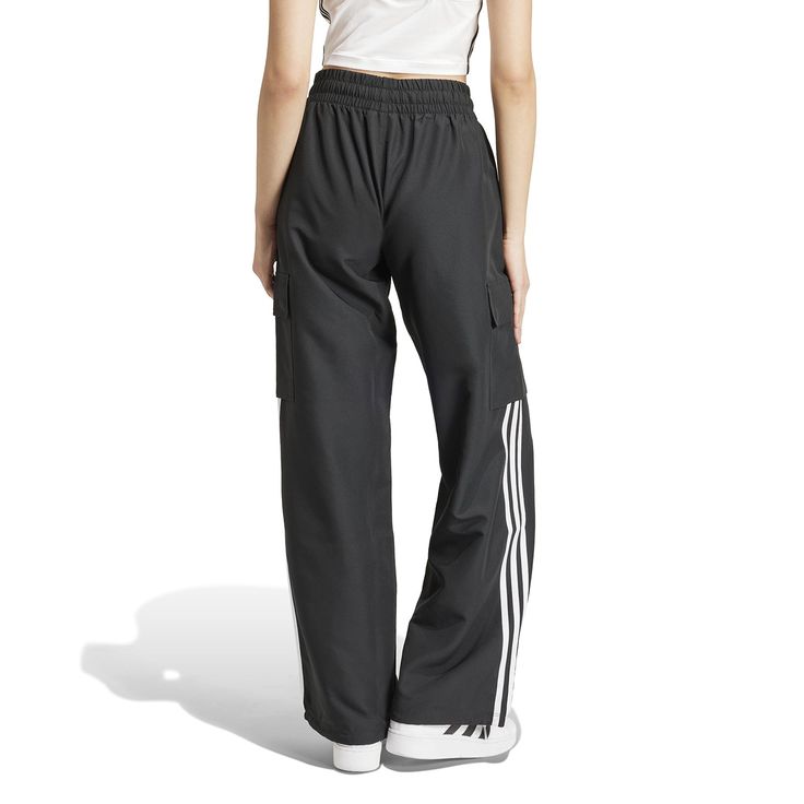 Wide legs make for comfortable days... The adidas Wide Leg Women's Cargo Pants give you plenty of room to move, along with handy cargo pockets to store your belongings. And with the iconic adidas stripes down the side, you can get the comfort and classic style the brand is known for.Features adidas three-stripe design. Relaxed fit. Elastic waistband. Features two cargo pockets. Material: 100% Polyester. Consists of at least 40% recycled materials. Contains 50% Parley Ocean Plastic. Adidas Sporty Sweatpants With Pockets, Adidas Athleisure Sweatpants With Pockets, Wide Leg Sports Bottoms With Cargo Pockets, Adidas Joggers With Pockets For Streetwear, Adidas Joggers With Pockets For Sports, Sports Bottoms With Cargo Pockets And Wide Leg, Adidas Jogging Bottoms With Pockets, Adidas Athleisure Joggers With Pockets, Functional Adidas Bottoms For Jogging