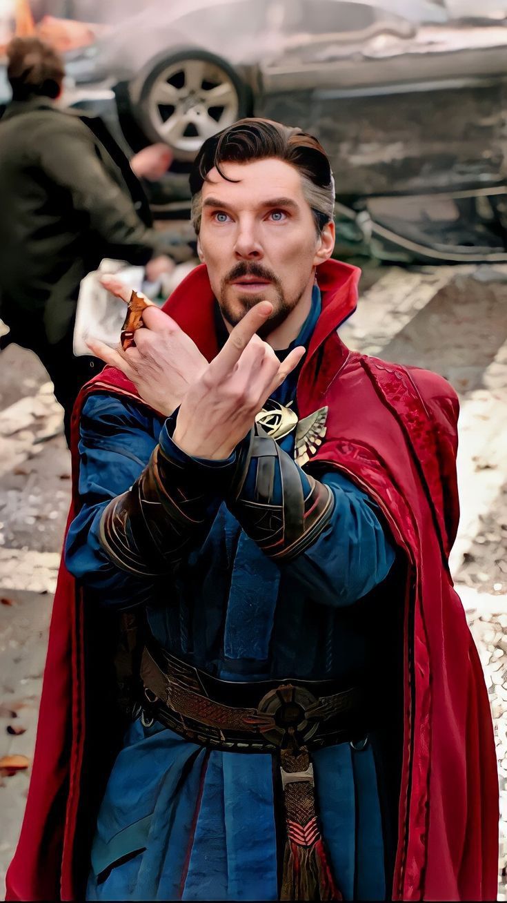 a man dressed up as thor from the avengers is holding his finger to his mouth