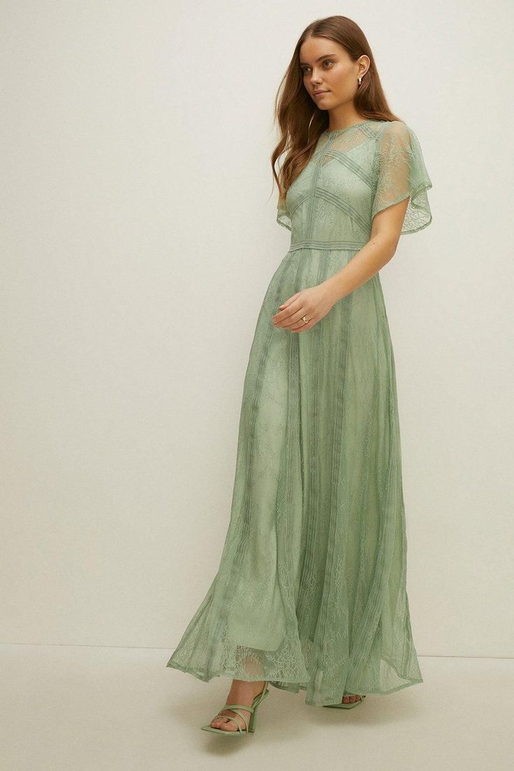 Style: Maxi DressLength: MaxiNeckline: CrewSleeve Length: Short Sleeve Green Boho Bridesmaid Dress, Short Bridesmaid Dresses With Sleeves, Subtle Floral Bridesmaid Dresses, Garden Party Bridesmaid Dress Green, Sage Green Dress Formal Modest, Sage Green Boho Bridesmaid Dresses, Mint Maxi Dress, Sage Green Lace Bridesmaid Dresses, Tj Maxx Dresses