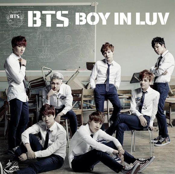 bt's boy in luv is posing for a photo with their teacher and other students