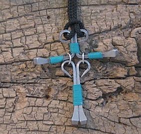 a blue and silver cross on a black cord