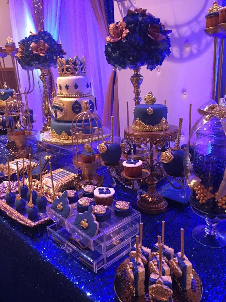 a table topped with lots of cakes and desserts