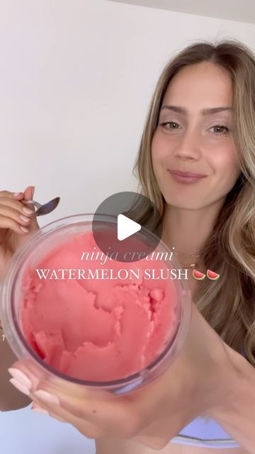 a woman is holding up a bowl of ice cream