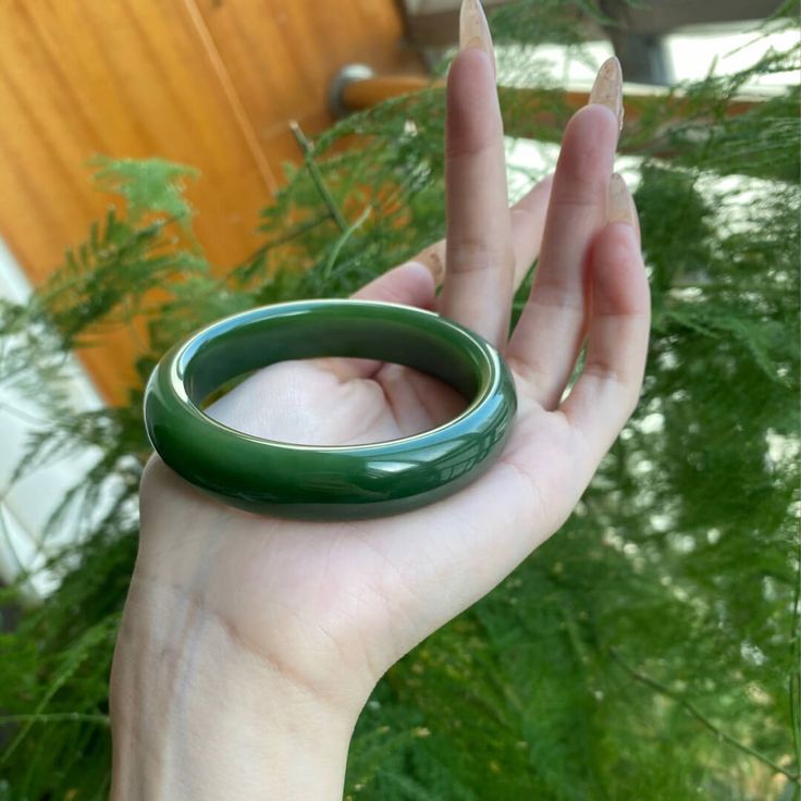 △ Handmade
△ Jade
△ Inside Diameter: 51mm-64mm
△ Gemstones are 100% genuine
△ The bangle is solid and significant. It is smooth and solid on your wrist.

“This jade bangle is breathtaking. It is slightly transparent with a pattern visible inside. The color is like in the photo, calming dark green. The fit is so comfortable.”-Julianne

All stones are unique and may vary from the one shown in the picture. Each jade bangle is handmade for you and comes packaged in a beautiful gift box.  Your purcha Bring Good Luck, Glass Bangles, Bangles Making, Jade Bangle, Good Luck To You, Green Crystal, Dream Jewelry, Green Crystals, Beautiful Gift Boxes