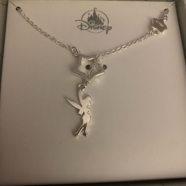 Hi, Brand New Never Worn Or Taken Out Of Packaging Adorable Disney Tinker Bell Necklace In Silver Color Necklace Was Given As A Birthday Present And Can’t Wear The Earrings Which Are Listed Separately So Decided To Sell Necklace Too. In A Beautiful Gift Given Packaging And If Bought Matching Earrings I Will Give Bundle Discount. Excellent Condition No Defects!! Personalized Disney Silver Jewelry, Themed Silver Jewelry For Disney Fan Events, Disney Silver Necklace For Gift, Disney Style Silver Necklace For Gift, Disney Style Sterling Silver Jewelry Gift, Disney Sterling Silver Jewelry In Silver, Disney Silver Jewelry With Charms, Disney Silver Charms Jewelry, Disney Style Silver Jewelry With Charms