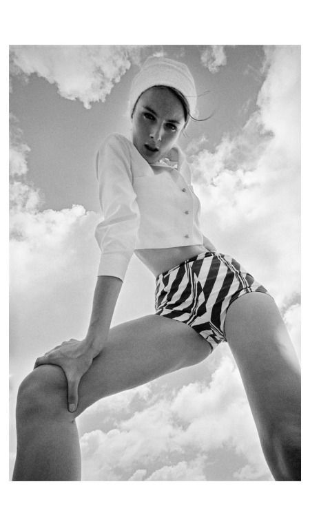 black and white photograph of a woman in striped shorts