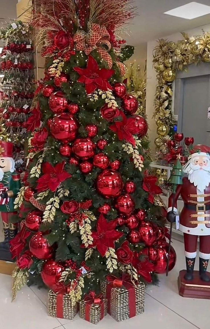 a christmas tree decorated with red and gold ornaments