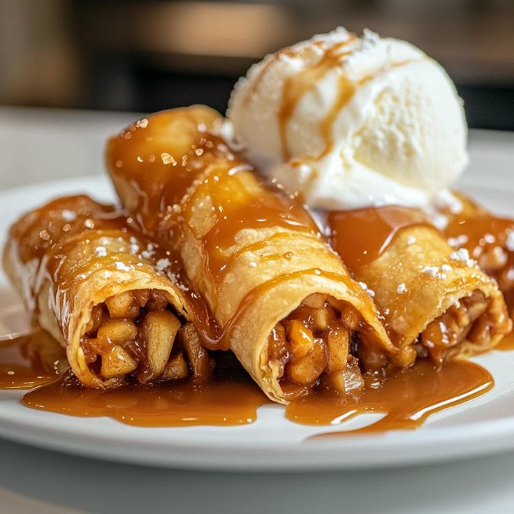 some food is sitting on a plate with ice cream and caramel sauce in it