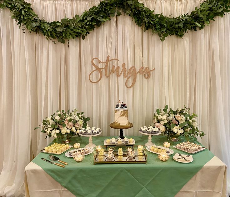 a table topped with cakes and desserts under a sign that says strings on it