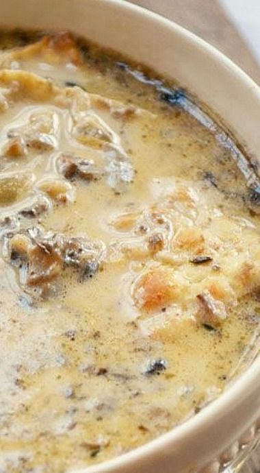 a white bowl filled with soup on top of a table