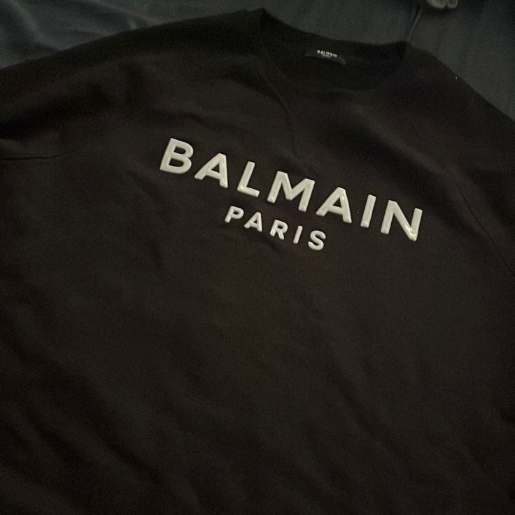 Balmain Sweater Black Xl Luxury Winter Sweatshirt With Letter Print, Luxury Tops With Logo Detail For Fall, Luxury Logo Tops For Fall, Luxury Logo Detail Tops For Fall, Luxury Black Cotton Sweatshirt, Designer Letter Print Sweatshirt For Streetwear, Luxury Black Sweatshirt For Streetwear, Black Luxury Sweatshirt With Letter Print, Designer Black Long Sleeve Sweatshirt